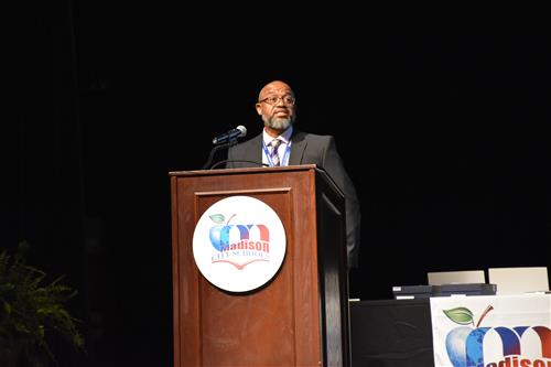 Chief Operations Director John Jones at podium